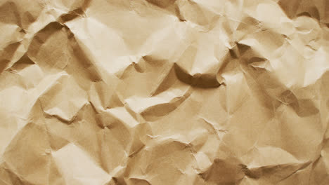 video of close up of crumpled brown paper texture background