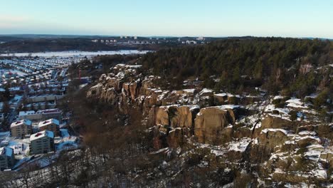 aerial - mountains in utby, suburb of gothenburg, sweden, wide spinning shot