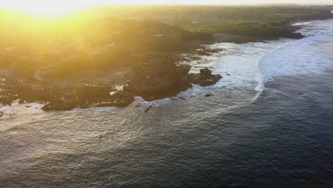 Ethereal-sunrise-aerial-orbits-Tanah-Lot-Hindu-temple