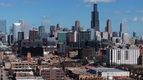 descending drone shot with amazing chicago skyline in background