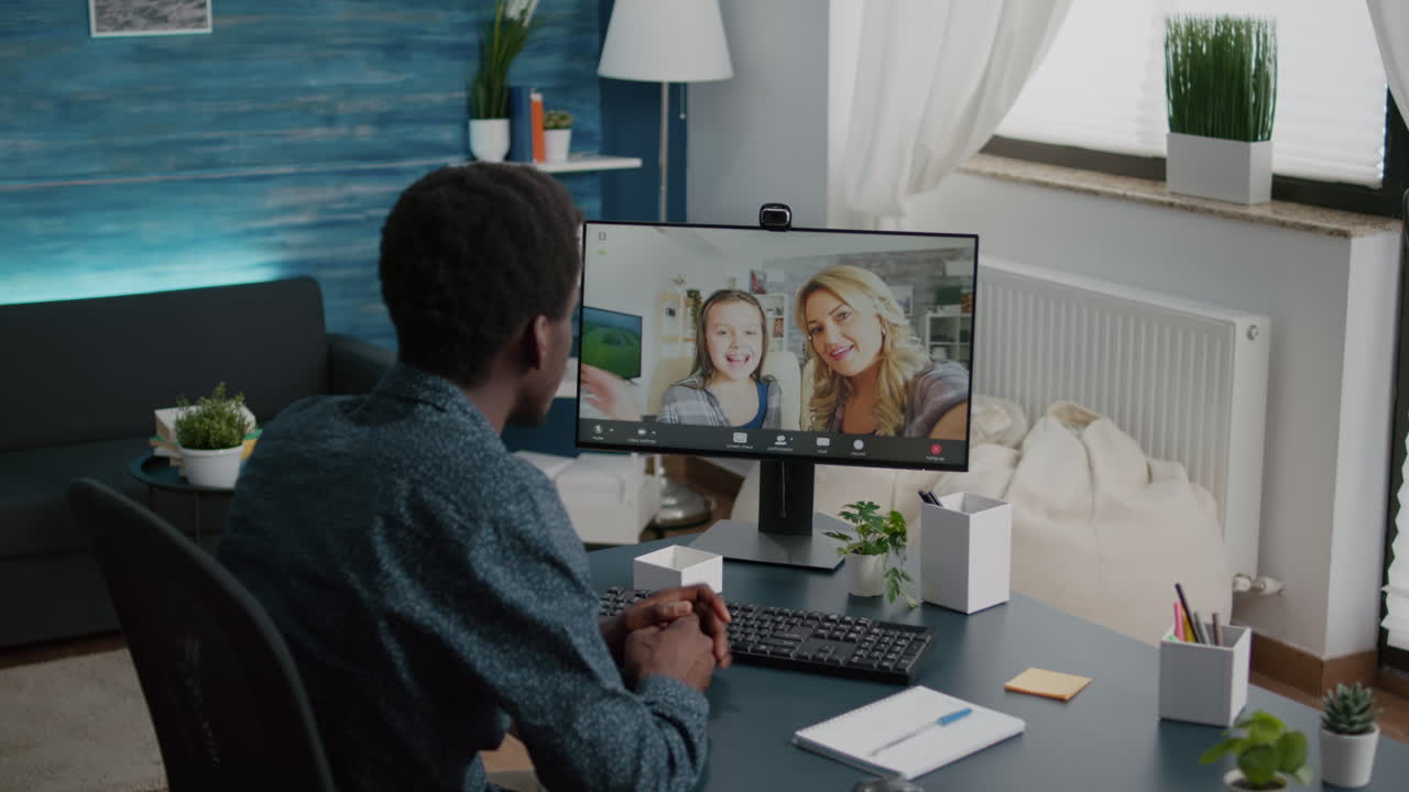 African american man talking with friends and family using online video call communication