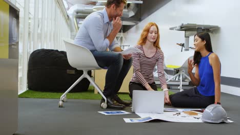 business colleagues discussing over documents 4k