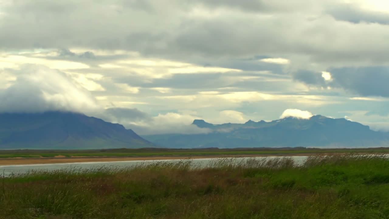 Time lapse of the clouds rolling in over the mountains.