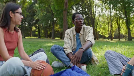 group of friends relaxing in a park