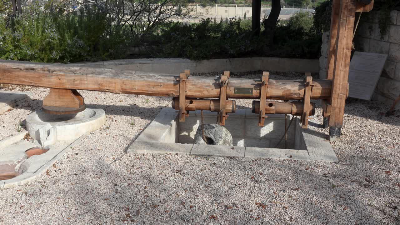 Replica of an ancient olive oil press - lever and stone