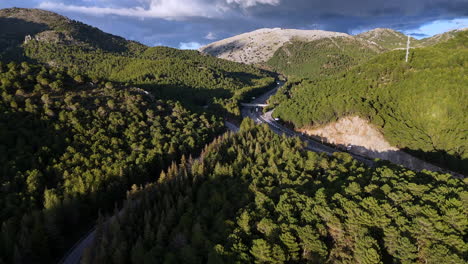 serpentine highway through verdant mountains