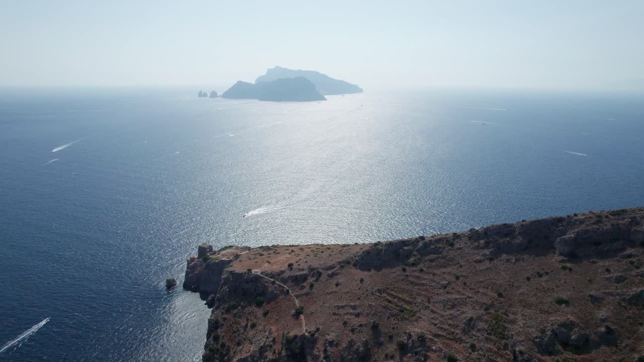 Aerial forward view of coastline and islands in a wonderful sea landscape. Salerno. Italy