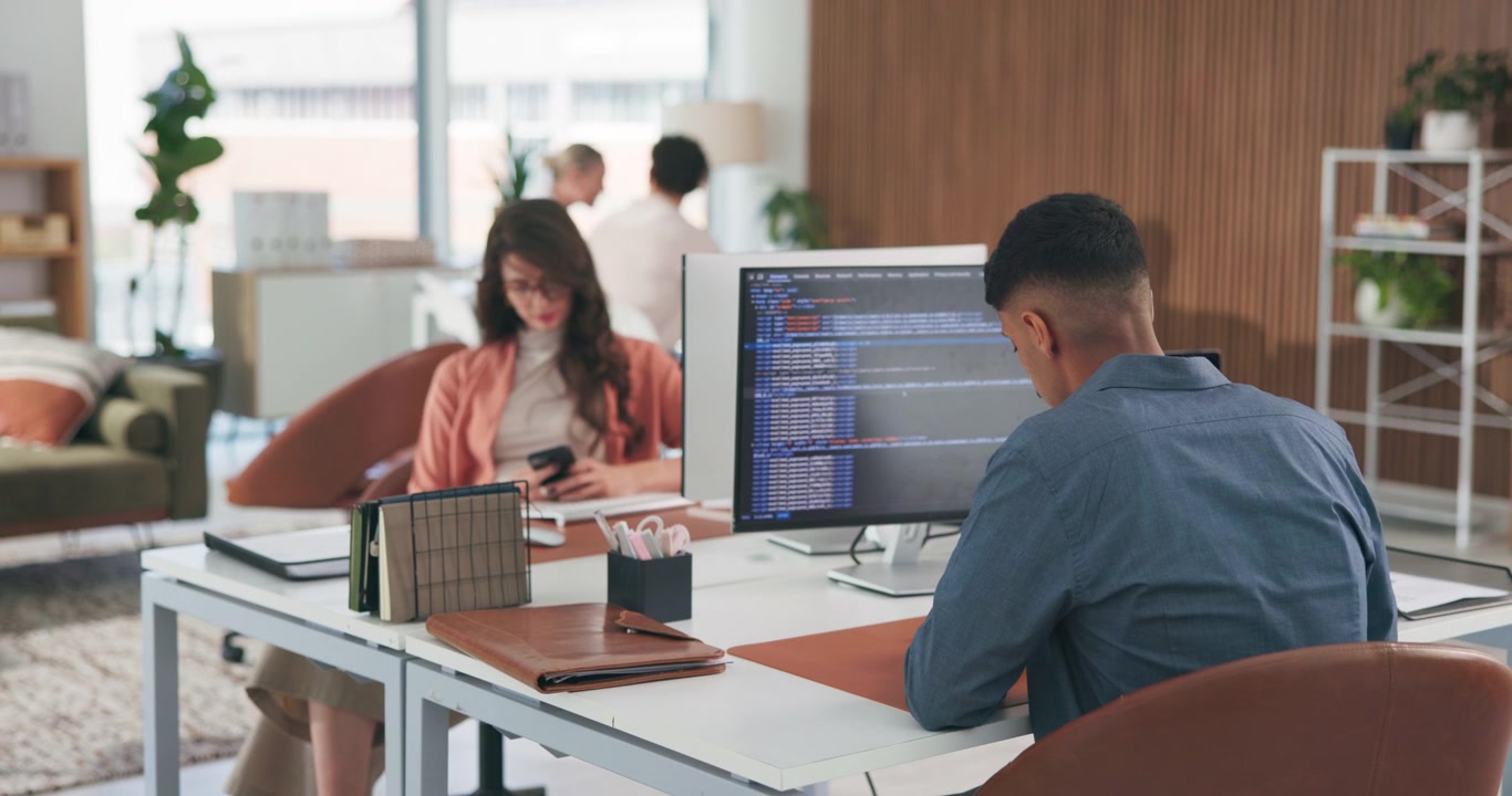 Software Developer Working on Code in Modern Office