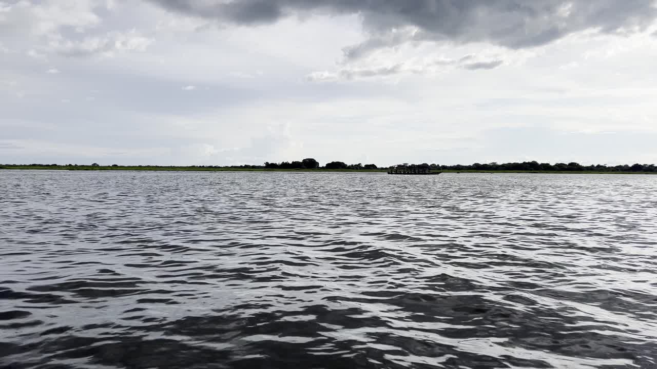 Boat tour through the tranquil waters of the vast Ciénaga de Pijiño in the Magdalena Department in Colombia on a sunny afternoon