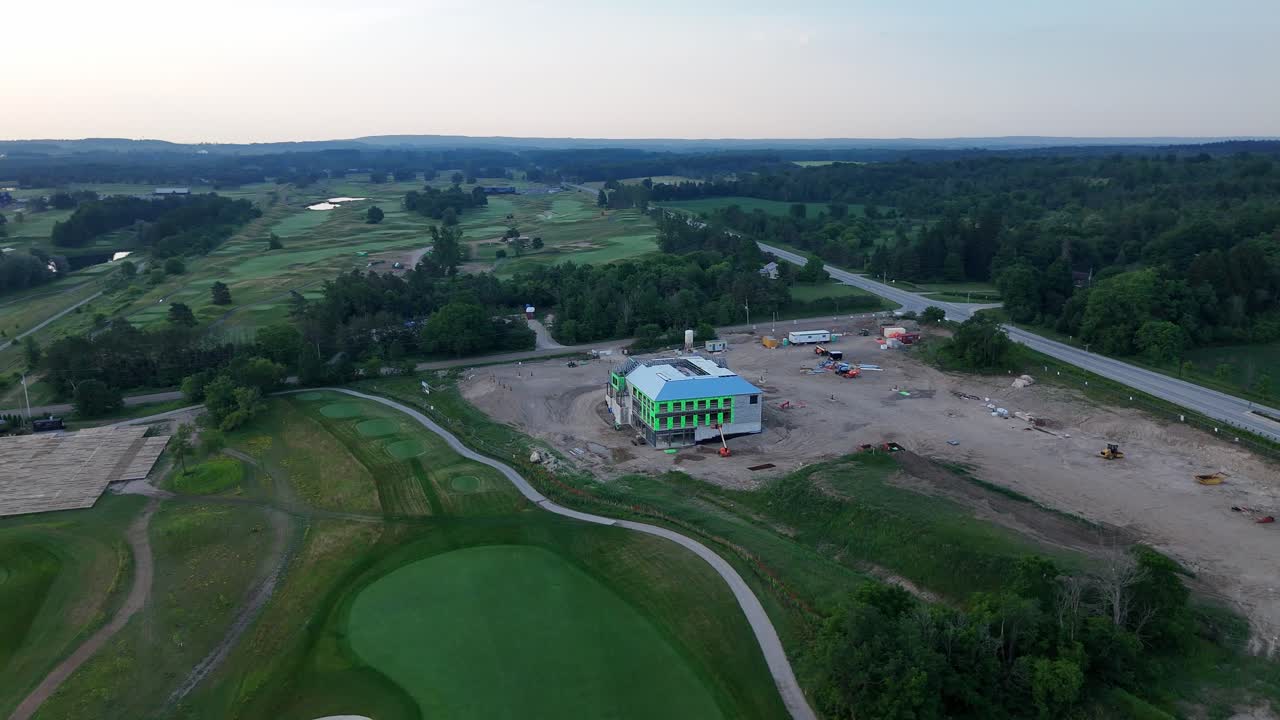 Rotating aerial footage showing the construction site of the Golf Canada Headquarters at TPC Toronto Osprey Valley Golf Course in Alton, Caledon, Ontario, Canada