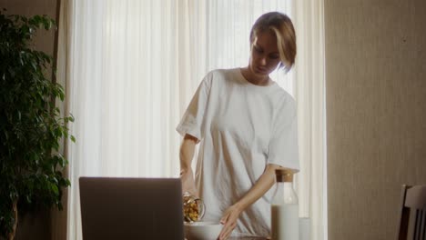 woman having breakfast at home