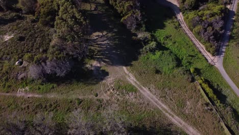 Tilt-down-view-over-the-old-Quinns-Rocks-caravan-park-site-showing-disused-land-with-tyre-tracks