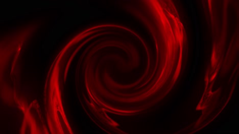 vortice di fluido rotante rosso che si muove lentamente su uno sfondo nero