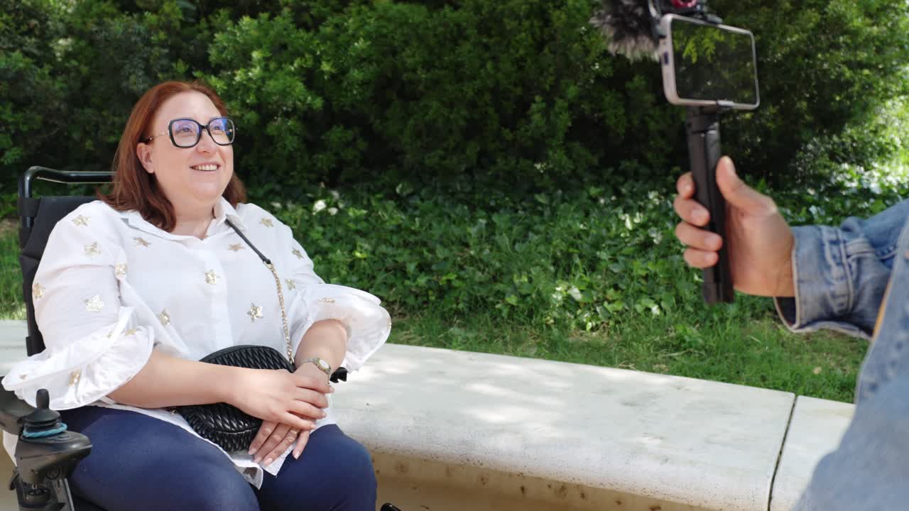 Woman in Wheelchair Being Interviewed