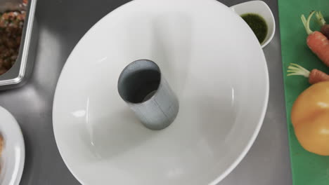 view of meal ingredients lying on counter in kitchen, slow motion