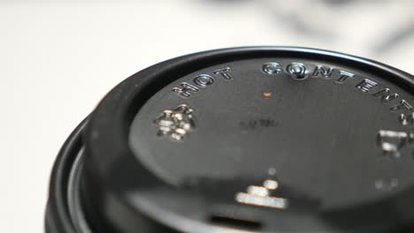 close up of a coffee cup lid