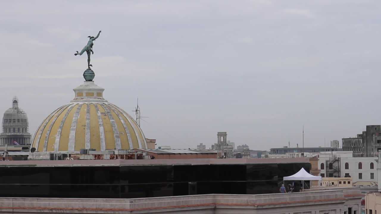 Havana cityscape with Capitol Building dome and statue
