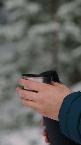 person drinking outdoors