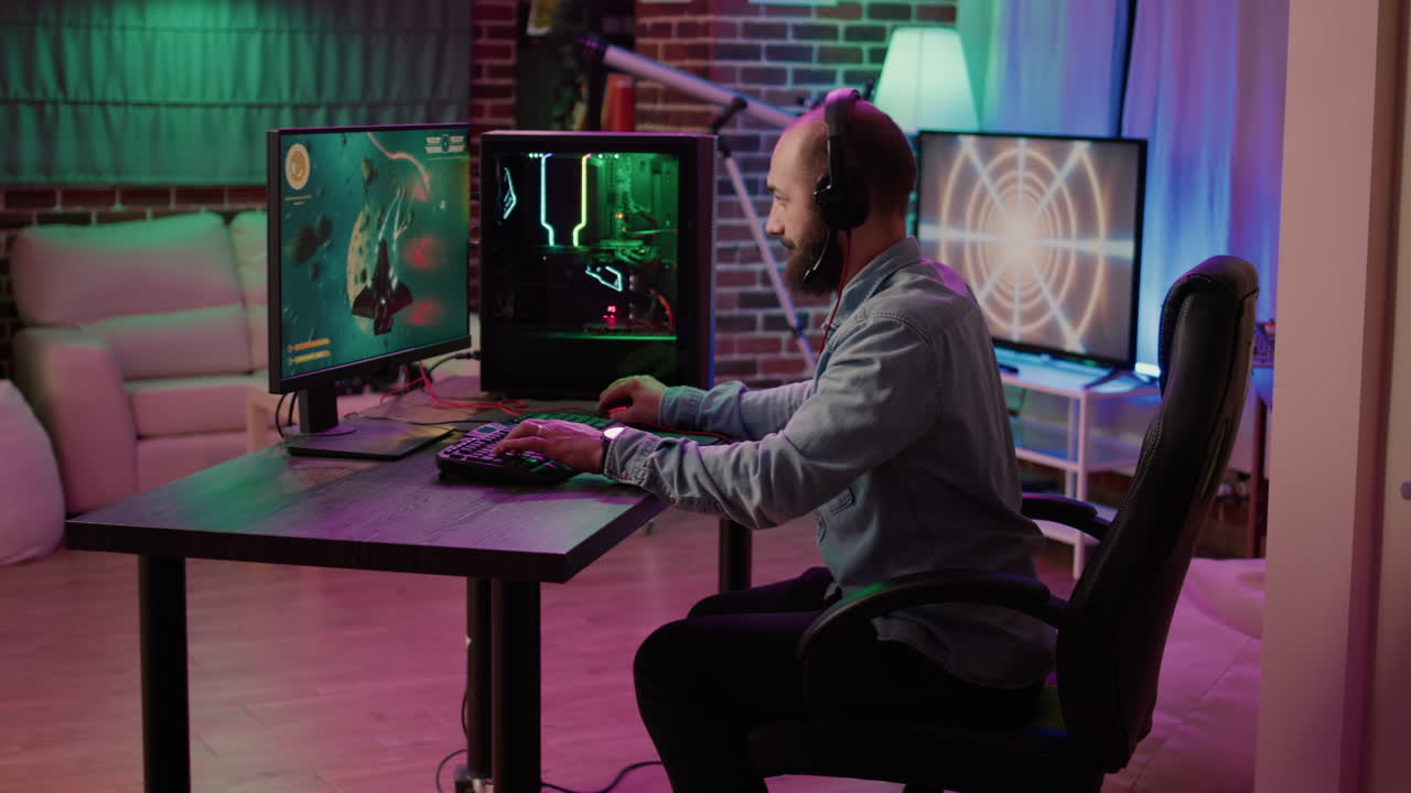 Gamer playing fast paced space shooter simulation screaming victorious at the computer screen after winning