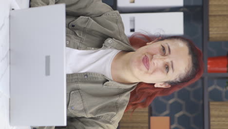 Vertical-video-of-Cheerful-and-happy-happy-business-woman-waving-at-camera.