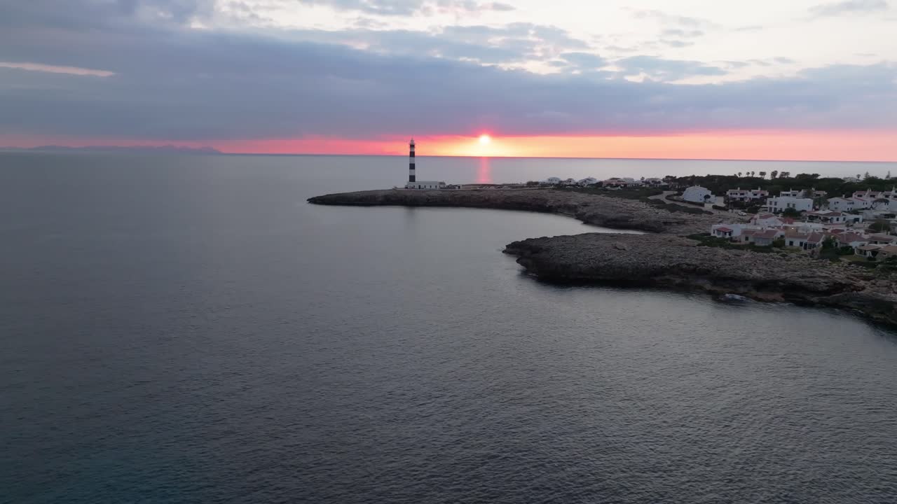 Aerial fly at sunset, Lighthouse on the Sea – Aerial Travel Destination in Menorca Spain