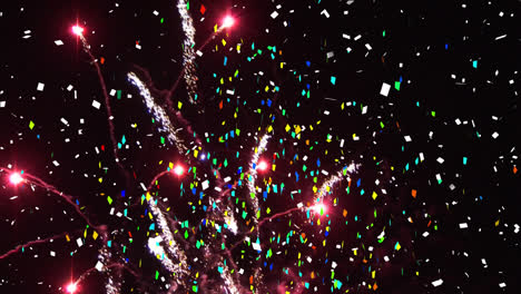 animation of confetti and fireworks exploding on black background