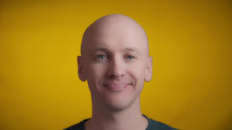 Man winking with a kiss to the camera