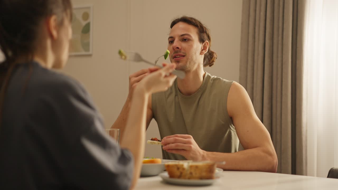 Couple eating at a table