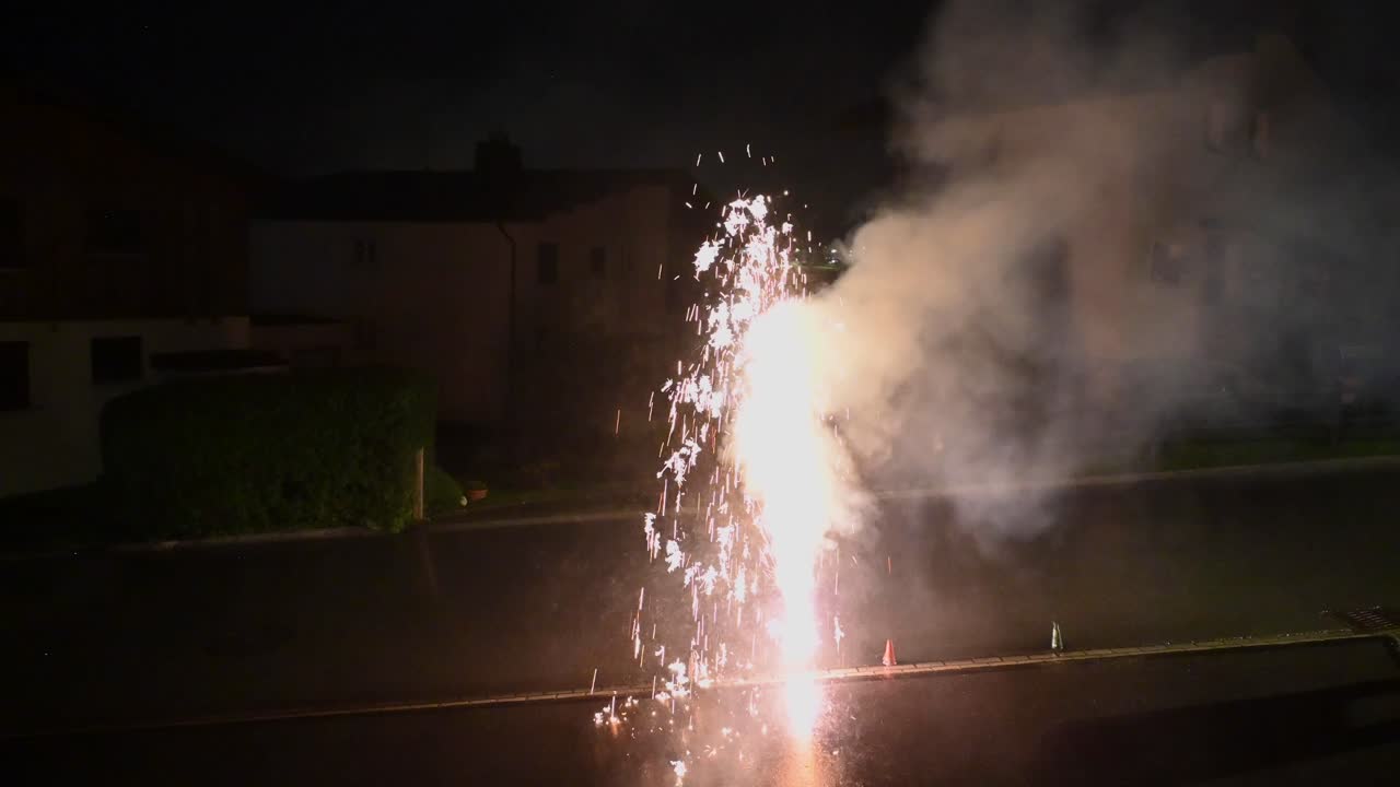 A firework in the night makes smoke and sparkling ashes, Switzerland, Celebration day, First of August