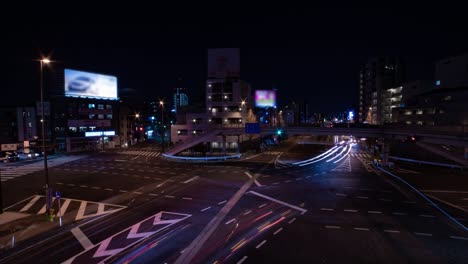 a night timelapse of the traffic jam at the city street in tokyo wide shot