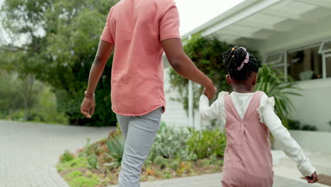 dad, girl walking and holding hands together