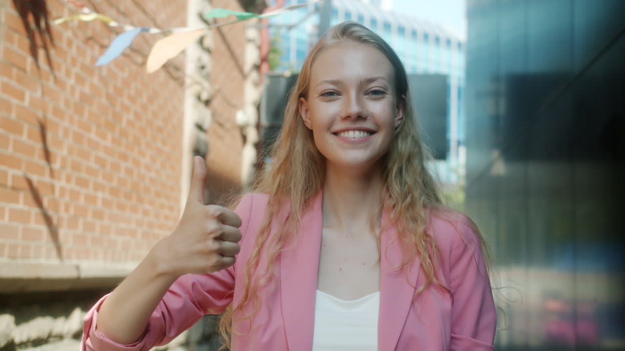 Smiling Woman in Pink Jacket Outdoors