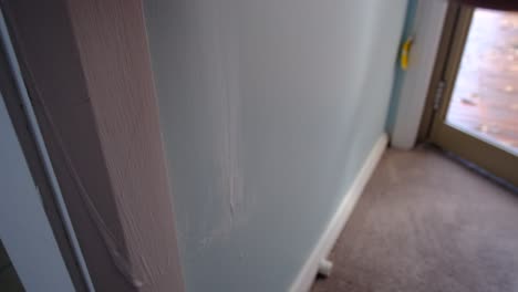 wiping walls with cleaning cloth after guests made dirty