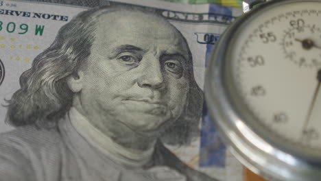 analogue metal stopwatch on the american dollars