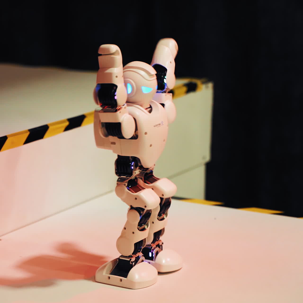 Dancing humanoid robot on the exhibition. Toy robots. Science Festival