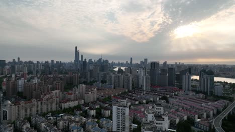 drone aerial view of buildings, cityscape and river in downtown