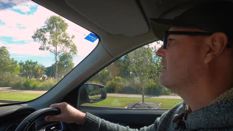 a stressed and angry middle-aged male driver. the man appears upset, frustrated and suffering road rage.