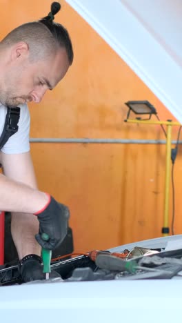 professional mechanic working on a car engine