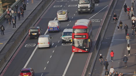 traffic and people crossing westminster bridge london