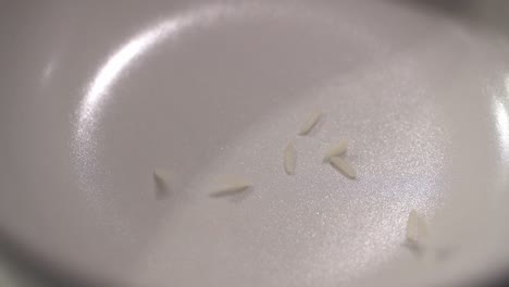 rice falling into a bowl in slow motion