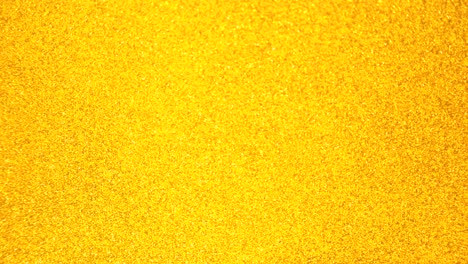decorative defocused abstract gold background with sparkling glitter. festive and holiday background for text. 4k footage