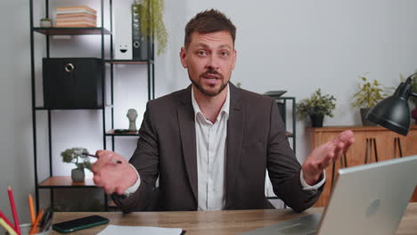 businessman working on laptop at office talk on online communication video call with employee, boss