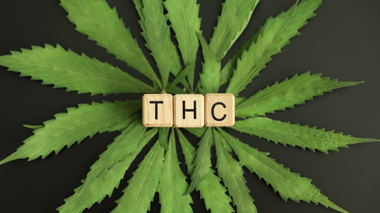 Cannabis leaves with THC letters