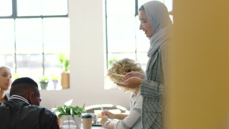 Meeting,-ideas-and-muslim-woman-speaker-with-phone