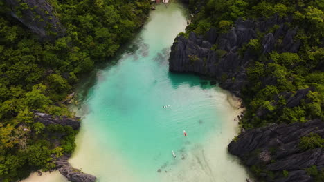 crystal clear of cadlao lagoon at el nido in palawan, philippines. - aerial shot