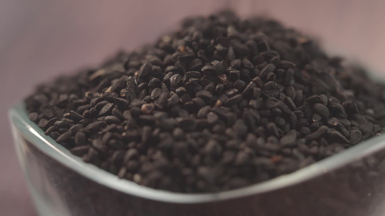Black Cumin Seeds Poured into a Glass Bowl
