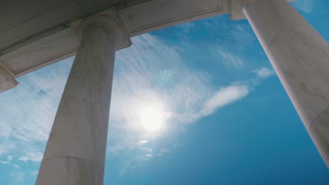 Arlington-Cemetery-Ampitheater-pillars-Sun-noon-Sky-Clouds-Sliding-Shot