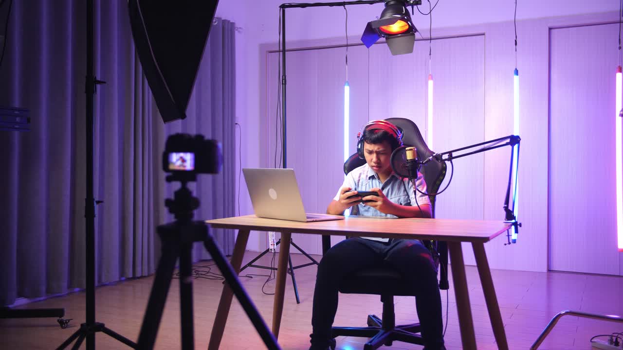 Asian Kid Boy Playing Video Game With Mobile Phone Then Lose The Game While Live Stream, Professional Light Equipment