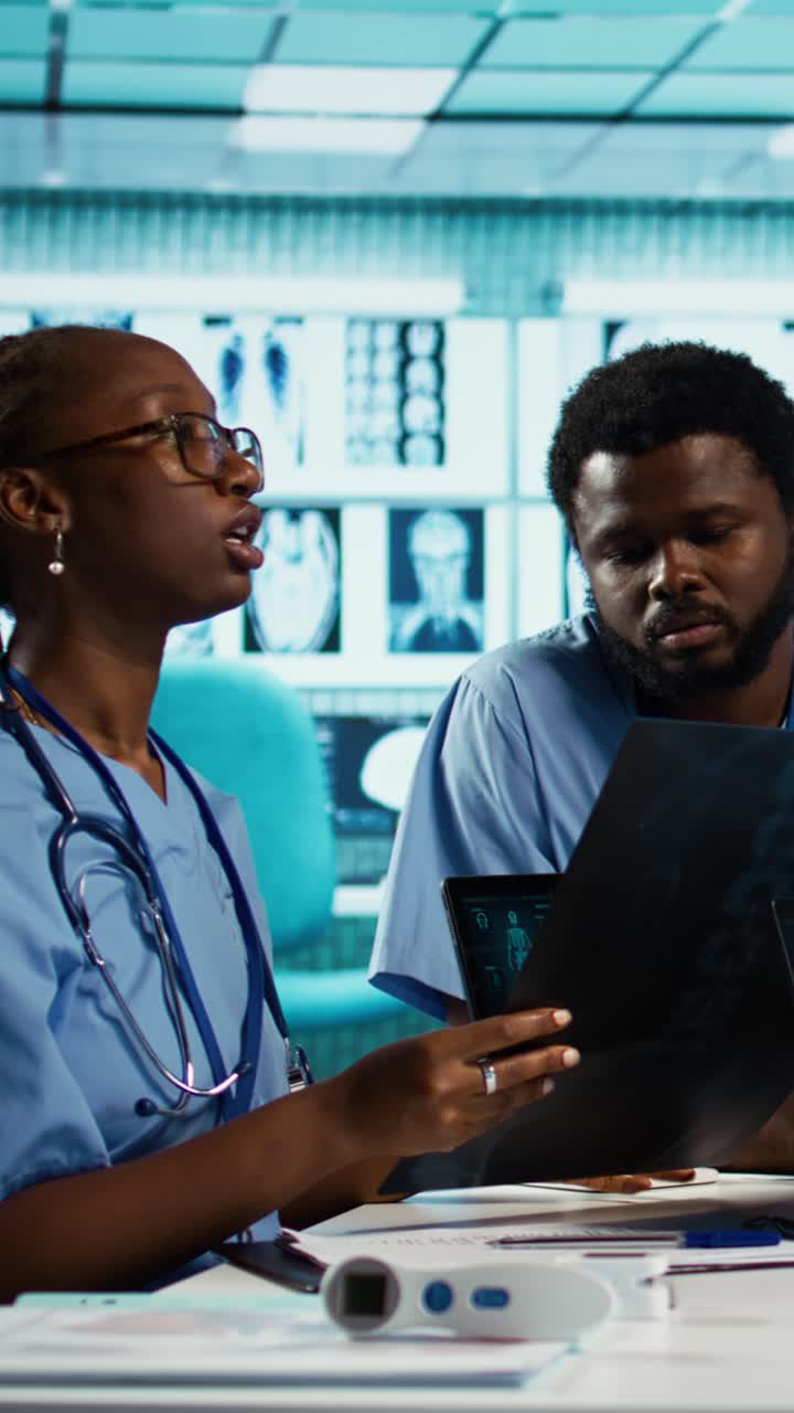 African American Medical Professionals Discussing X-Ray Images in Clinic