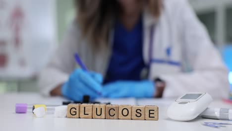 medical professional working with glucose testing equipment